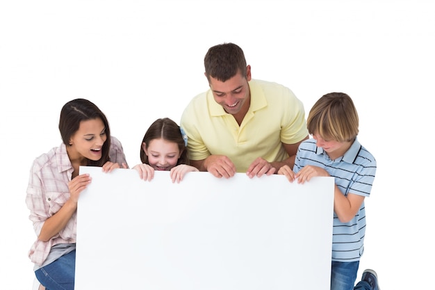 Family of four looking at billboard