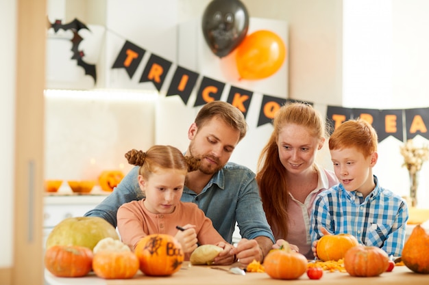 Family of four preparing for Halloween
