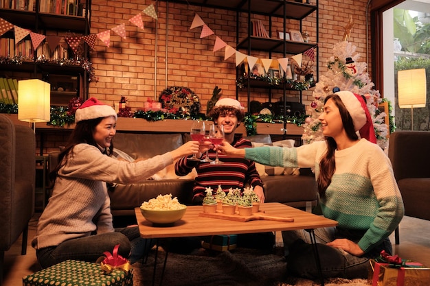 Family and friends a Christmas celebrating in homes living room