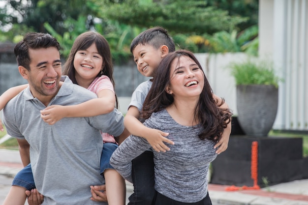 Family in front of their new house