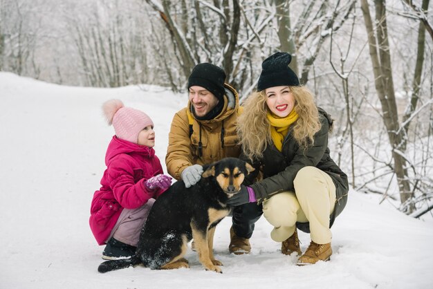 Family fun is photographed with a dog