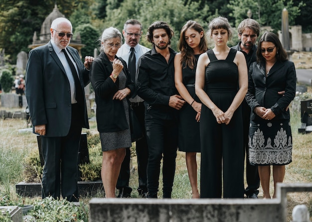 family giving their last goodbyes at the cemetery