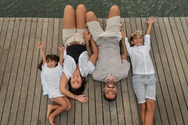 Family hanging out on a jetty