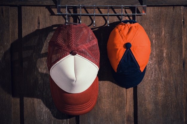 Family hat of father and son hanging on the wooden wall