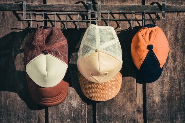 Photo family hat hanging on the wooden wall