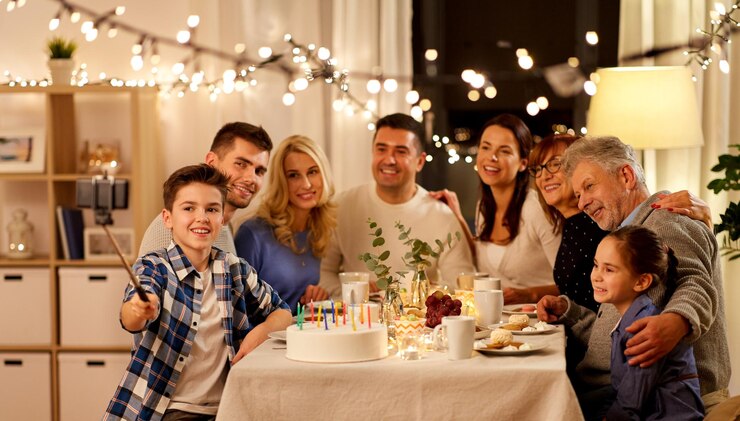 Photo family having birthday party and taking selfie