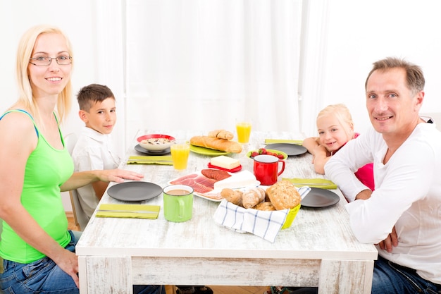 A family having breakfast at home.
