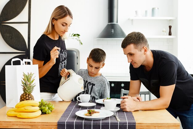 Family having breakfast in the kitchen