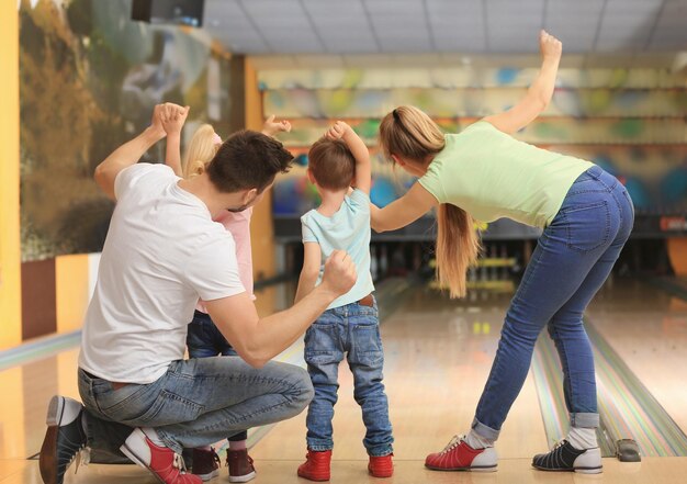 Family having fun at bowling club