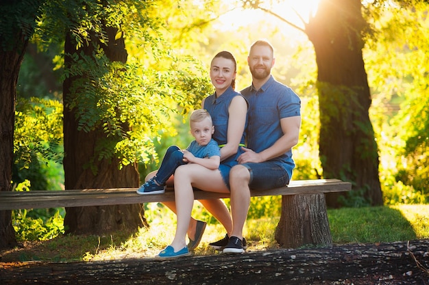 Family having a picnic in the park Dad mom son place for text