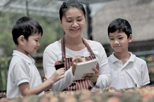 Family help take care of the cactus garden