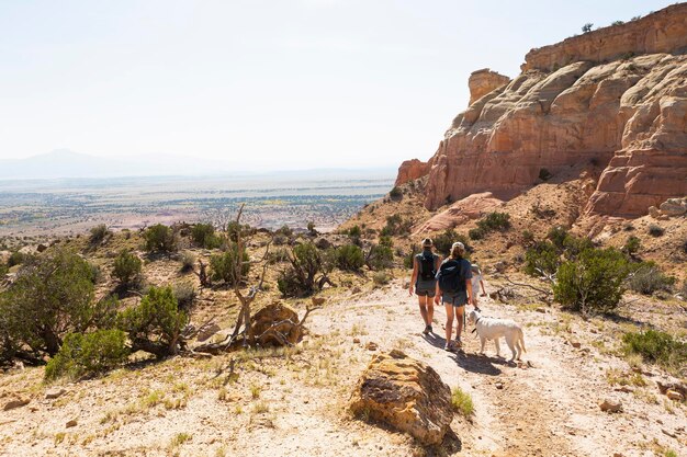 Family hiking on a trail through a protected canyon landscape