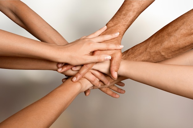 Family holding their hands together in shape