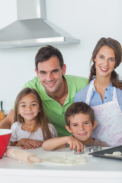 Family home baking together in the kitchen