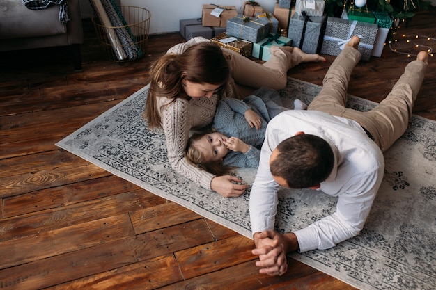 Photo family at home on floor on christmas