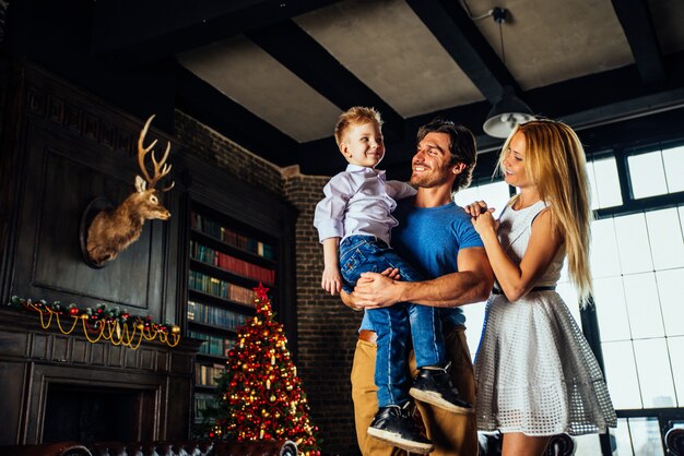 Family home portrait. Parents and son spending time together