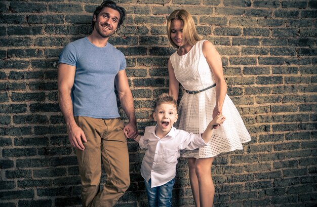 Family home portrait. Parents and son spending time together