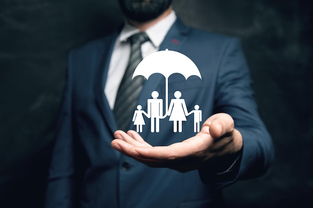 Family icon with umbrella Family protection Man holding in his hand