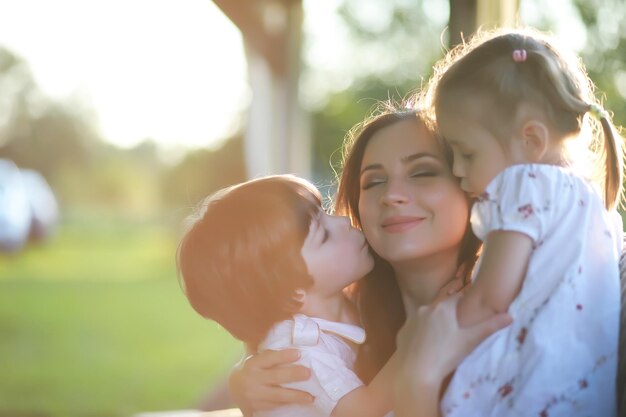 The family is resting in nature. Vacations in the fresh air. Weekend children play in the park.