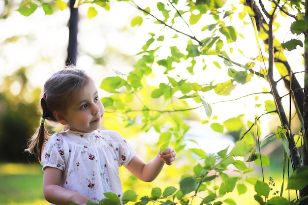 The family is resting in nature. Vacations in the fresh air. Weekend children play in the park.