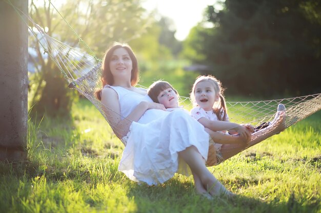 The family is resting in nature Vacations in the fresh air Weekend children play in the park