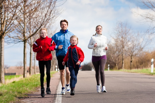 Photo family is running outdoors