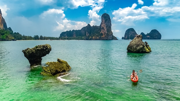 Family kayaking, mother and daughter paddling in kayak on tropical sea canoe tour near islands, having fun, active vacation with children in Thailand, Krabi