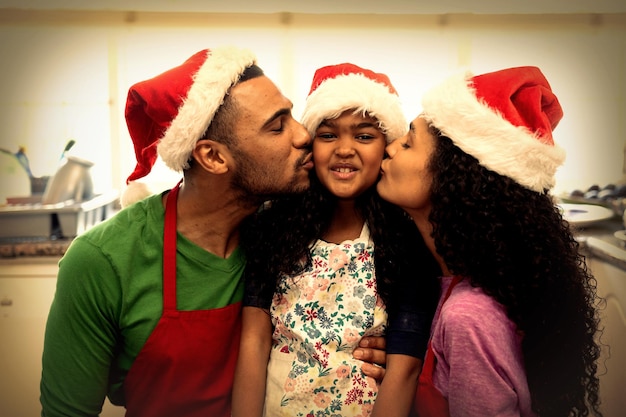 Family in kitchen at Christmas