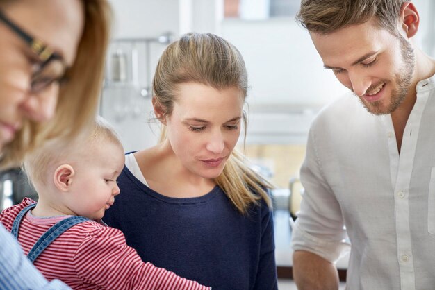 Family in kitchen looking down