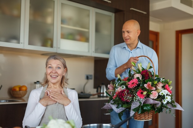 Family in the kitchen in mothers' holiday