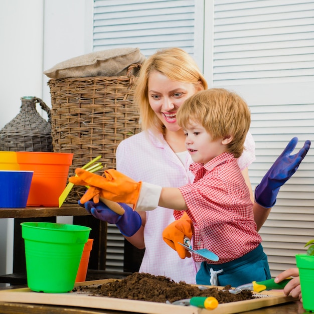 Family leisure happy mother and little child happy loving family little cute boy helps his parent mo