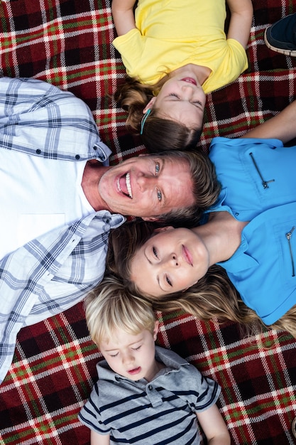 Family lying together in the park