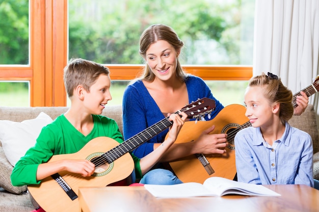 Family making music with guitar