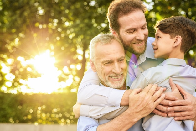 Family Meeting. Son Grandson and Old Man Hugs.