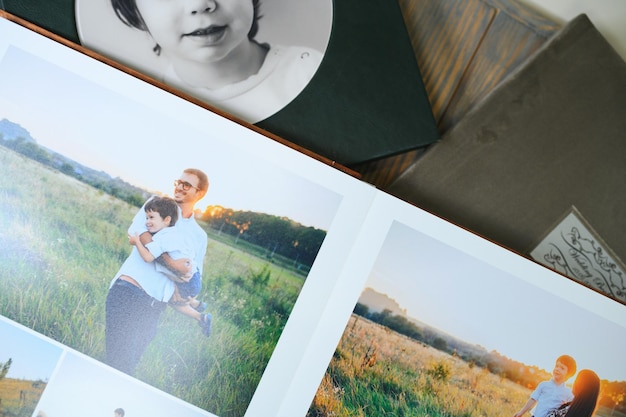 Photo family photo album against the background of the a wooden table