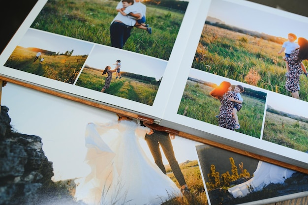 family photo album against the background of the a wooden table
