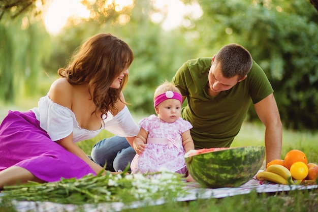 Family on picnic near the tree