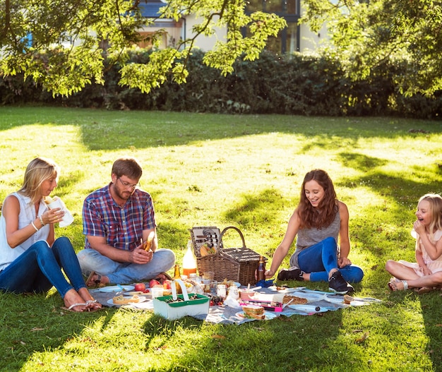 Photo family picnic outdoors togetherness relaxation concept