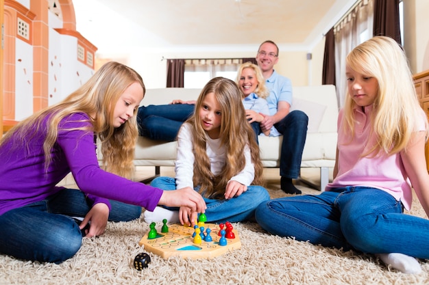 Family playing board game at home