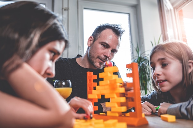 Family playing board games at home