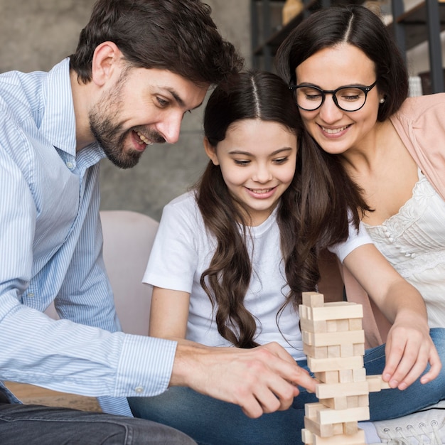 Photo family playing jenga together