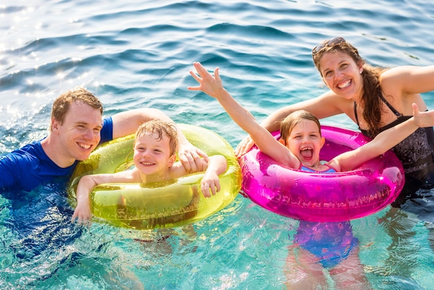 Family playing in a pool