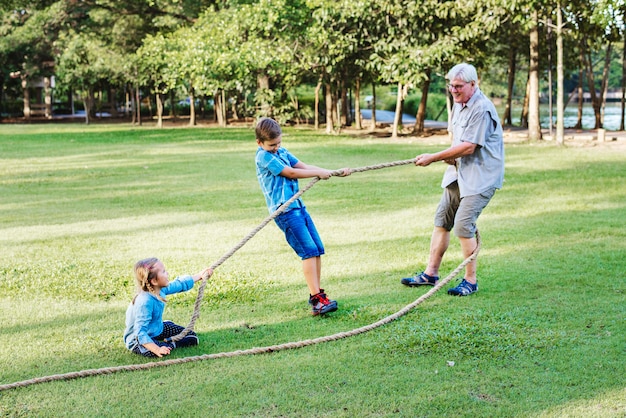 Family playing tug of war