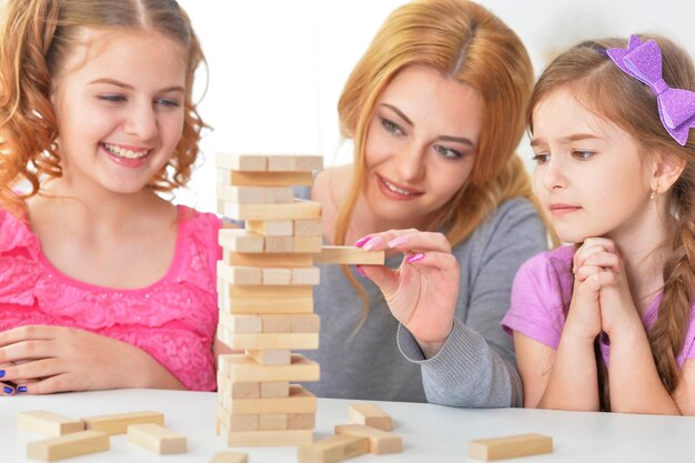 Photo family playing with blocks together