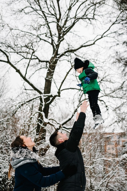 Family playing with their son outdoors