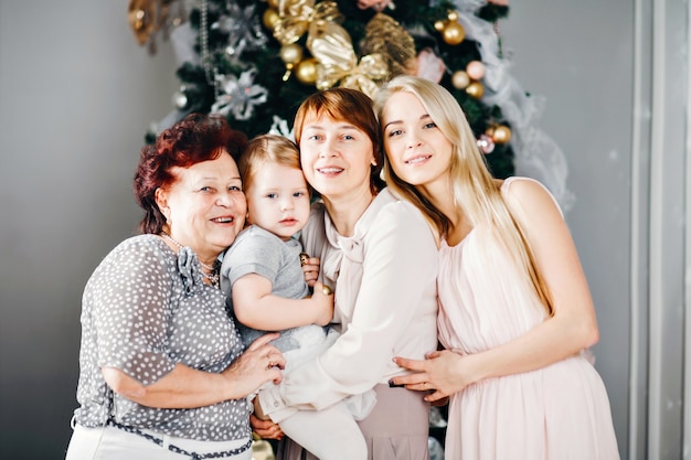 Family posing near the Christmas tree