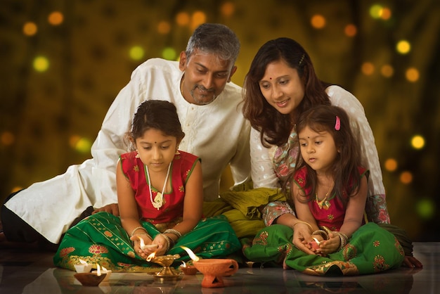 Family praying during diwali at night