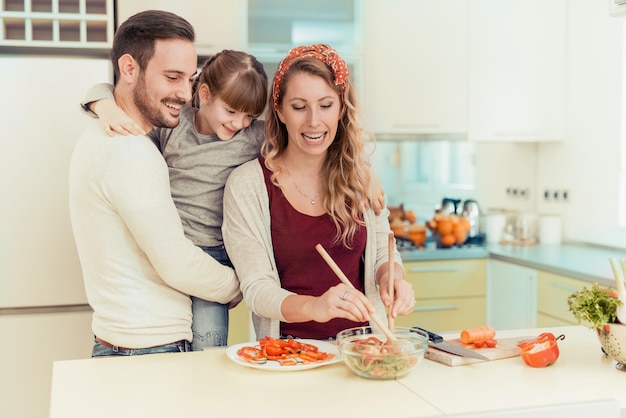 Family preparing breakfast in kitchen