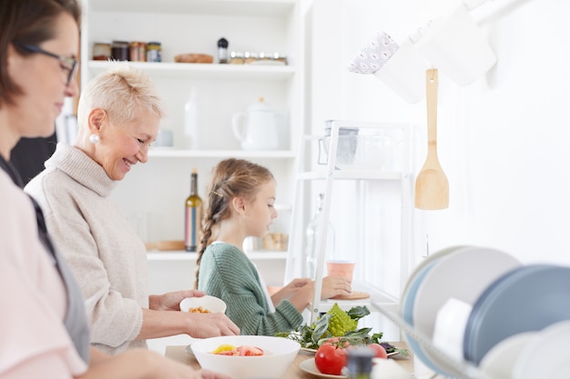 Family preparing food in the kitchen