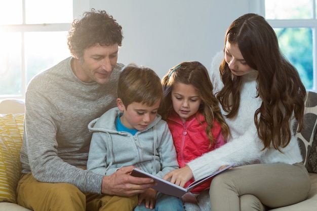 Family reading a book